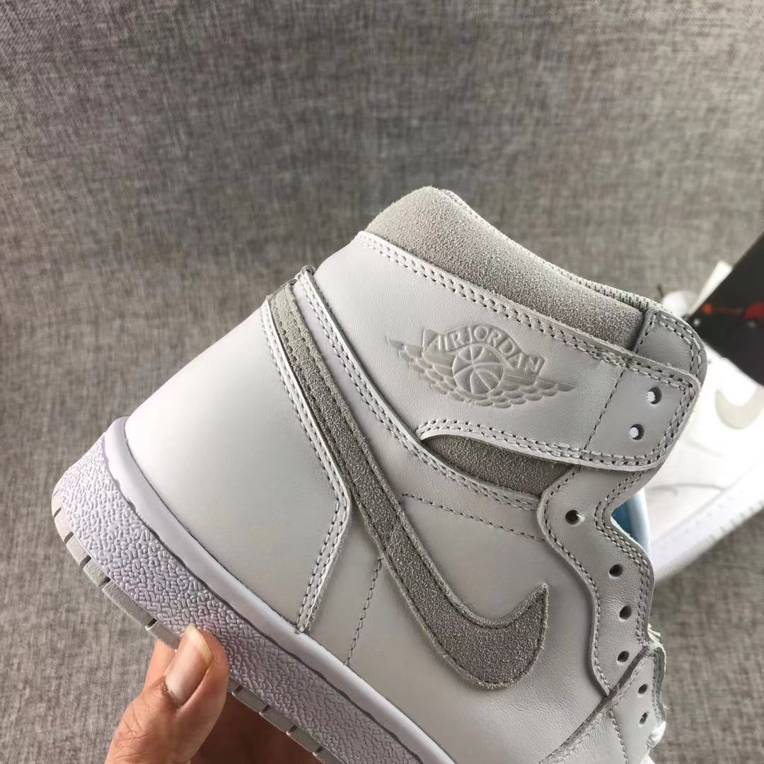 Close-up of the side panel showing the grey Swoosh and ankle wings emblem.