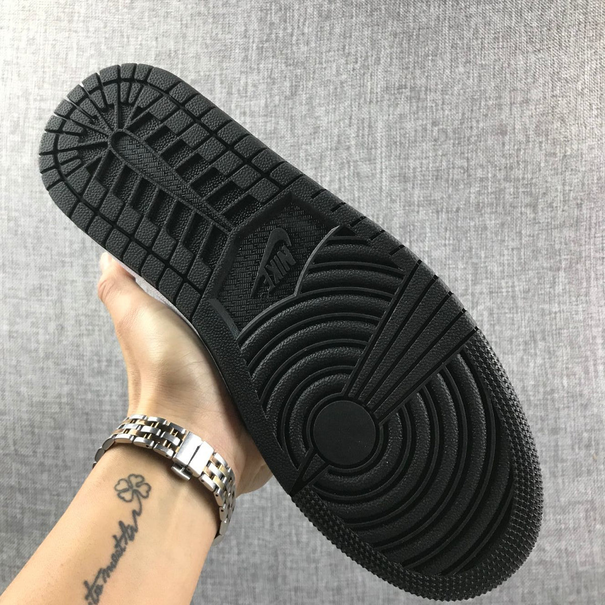 Underside view of the black patterned outsole