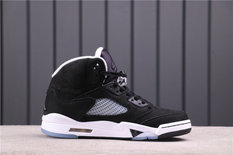 Side profile of one black high-top sneaker with a translucent side panel and white midsole.
