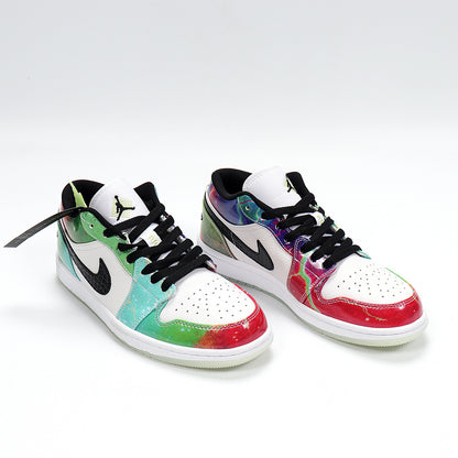 Three-quarter view of the multicolor low-top sneakers with white uppers, black accents, and light outsoles.