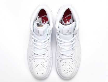 Top view of a pair of white high-top sneakers with perforated toe boxes and red interior branding.