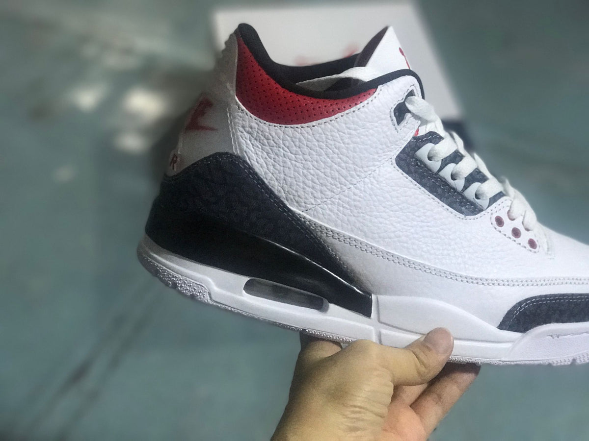 Side and heel view showing red collar accents and the midsole air unit