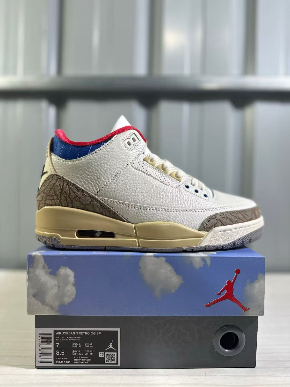 Side view of a white Jordan Air Jordan 3 Retro sneaker on its branded box; the box label shows EU 40, US Men 7, and US Women 8.5.