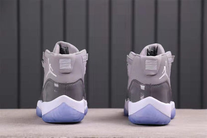 Rear view of the pair showing the padded collars, heel details, white logos, and translucent blue outsole sections.