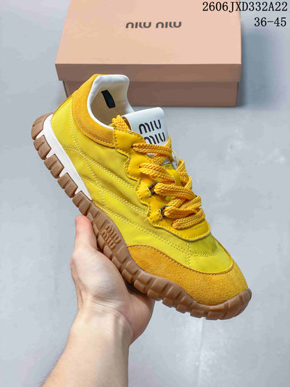 Miu Miu Tyre Low-Top Sneakers in Yellow