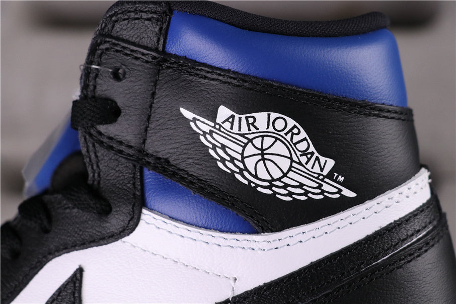 Close-up of a black and blue high-top sneaker with a white Jordan Wings logo.