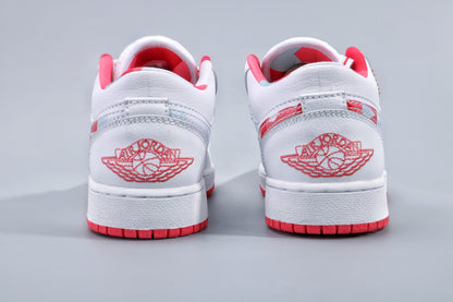 Rear view showing the embroidered Jordan wing logo, white heel panels, and red outsole.