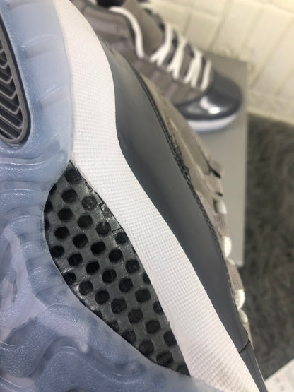 Close-up of the translucent outsole edge, white midsole, and black traction section.
