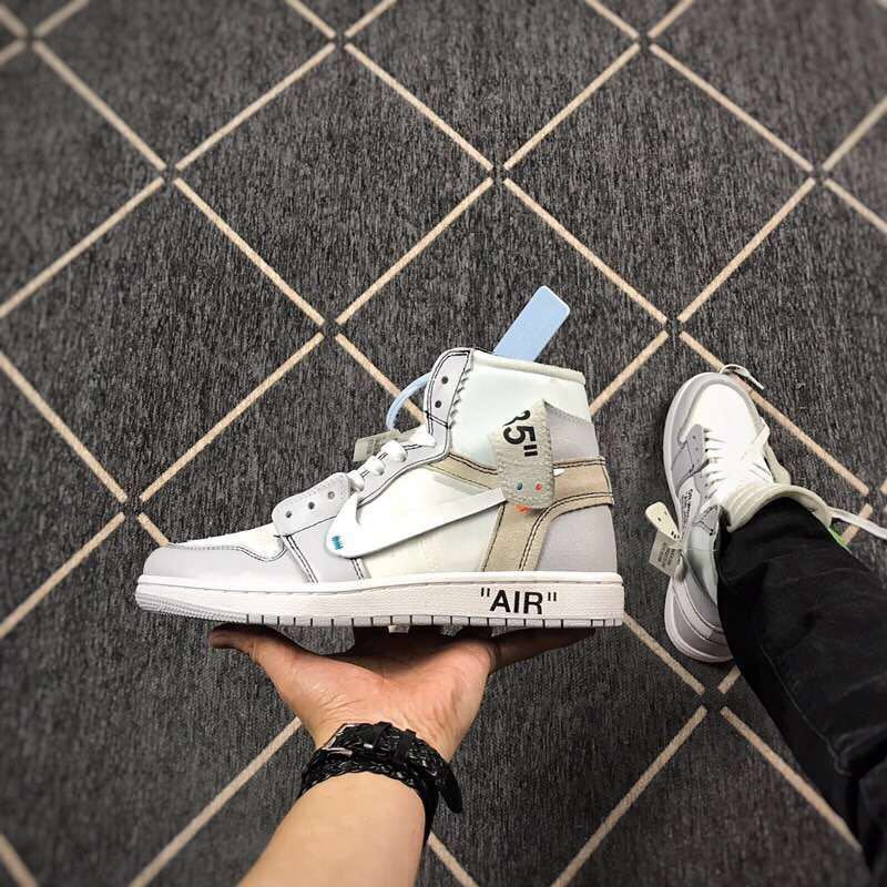 Side profile of the high-top sneaker showing the grey heel section, collar detail and white midsole.
