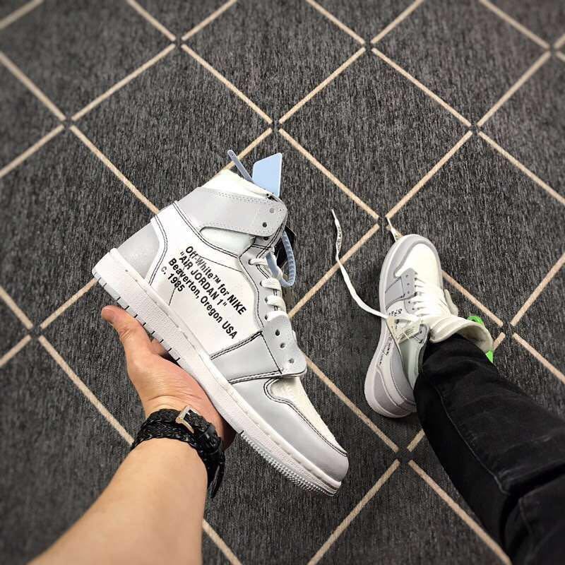 Side view showing printed text on the outer panel, grey overlays and the white midsole.