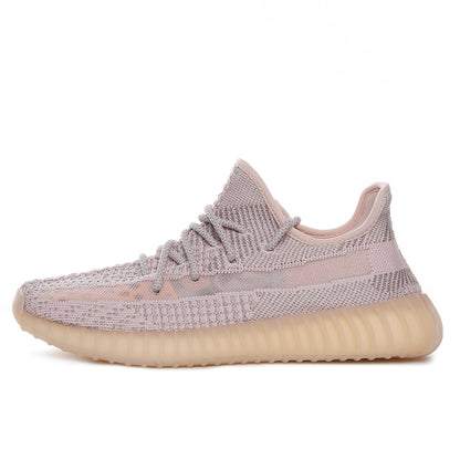 Profile view of a taupe-pink knit sneaker with a padded collar and ribbed translucent sole.