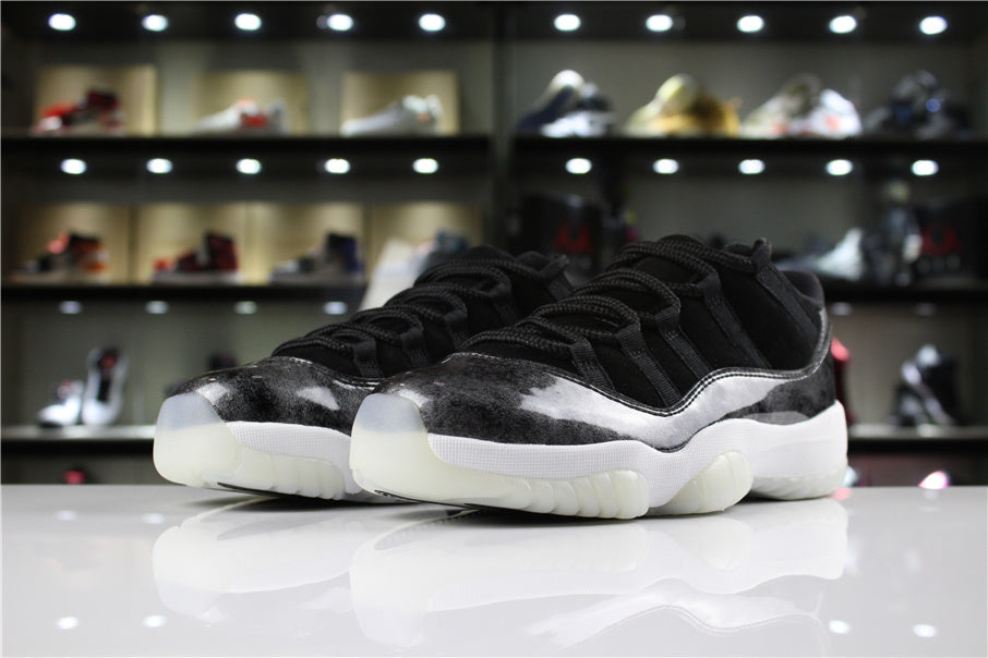 Angled front view of the pair showing black laces, silver toe panels, white midsoles, and translucent outsoles.