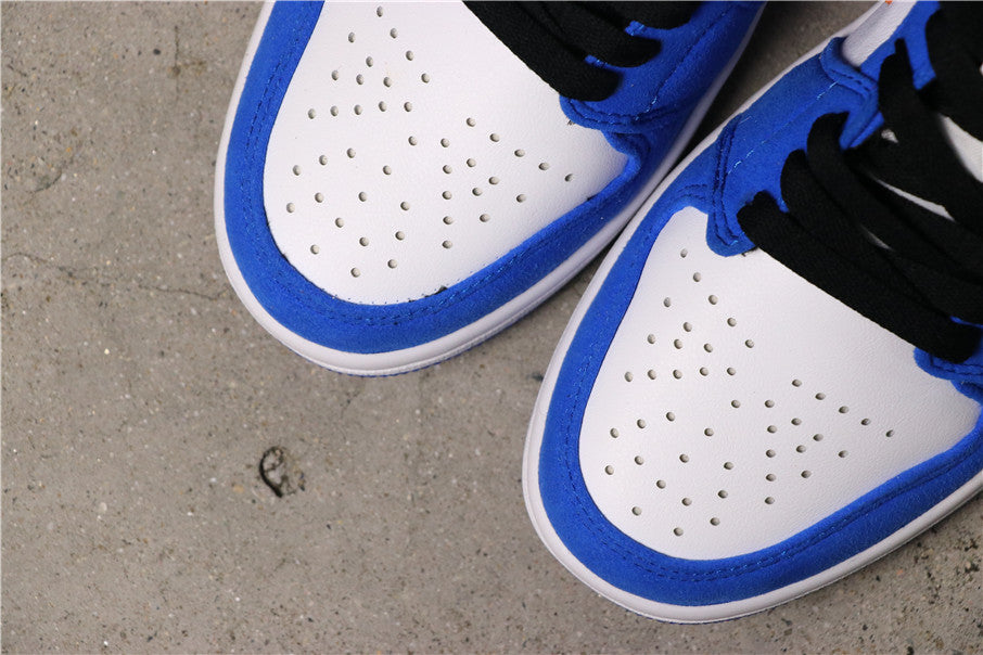 Close-up of the white perforated toe boxes surrounded by blue overlays.