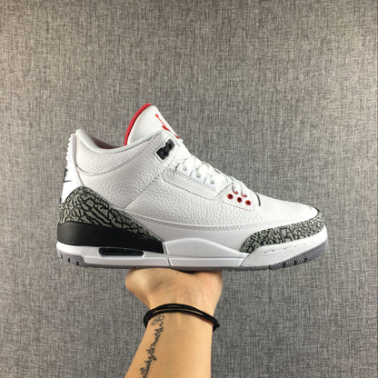 Side view of a white Jordan 3 sneaker with grey elephant-print overlays, black heel detail, and red accents