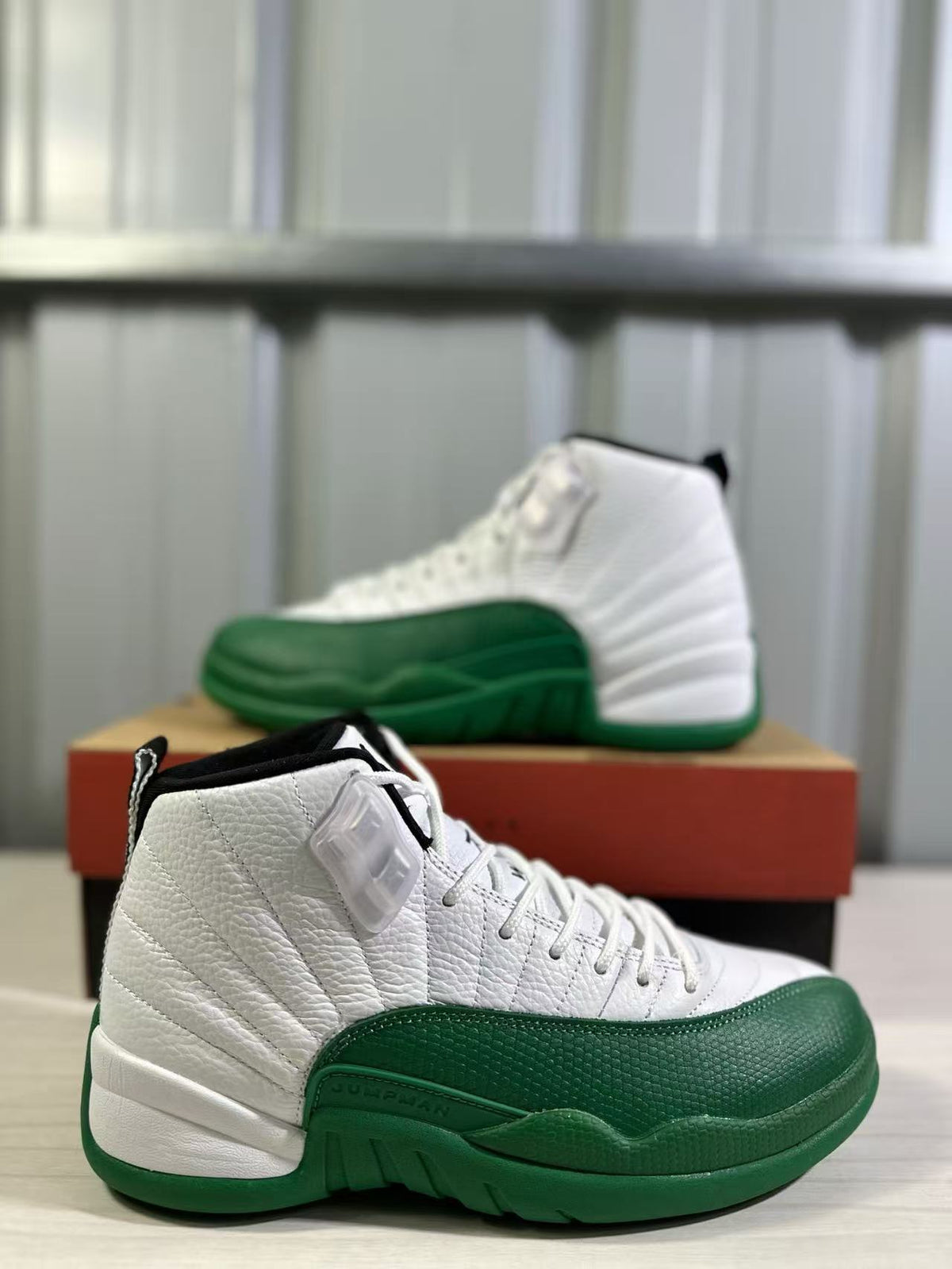 Close side view of the white upper, textured green forefoot and Jordan detailing.