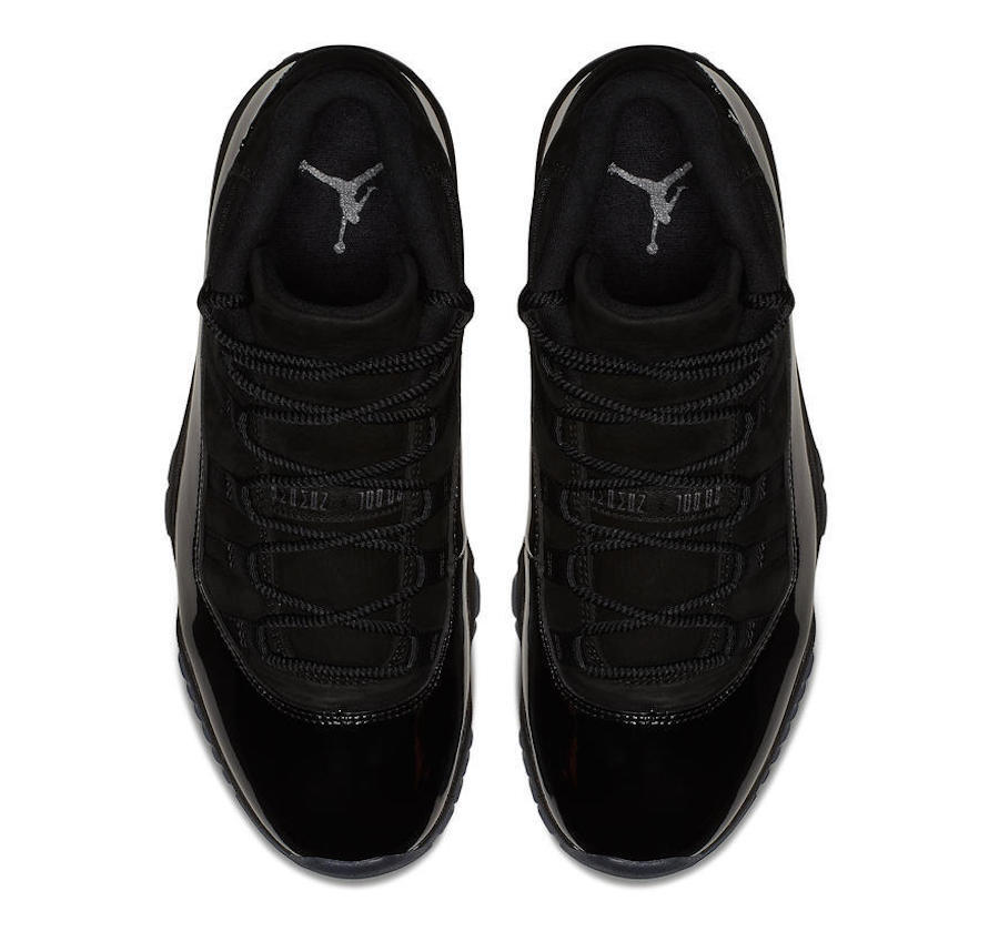 Top view of a pair of black high-top sneakers showing the laces and tongues.