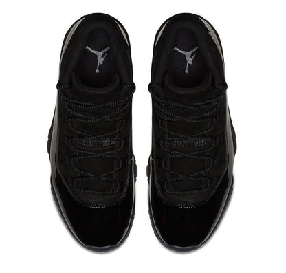 Top view of a pair of black high-top sneakers showing the laces and tongues.