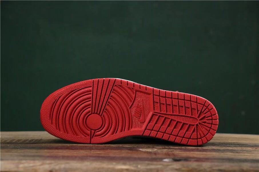 Close-up of the red outsole tread pattern.