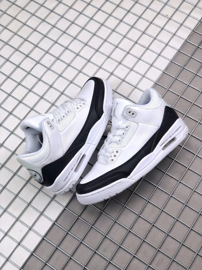 Pair of white and black sneakers displayed together from an angled side view.