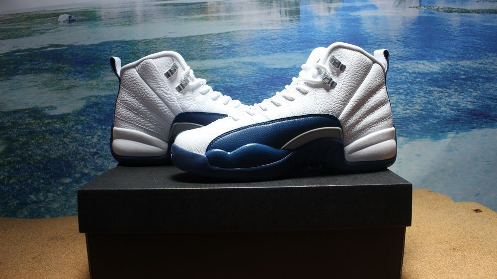 Side display view highlighting the white upper and dark navy outsole.