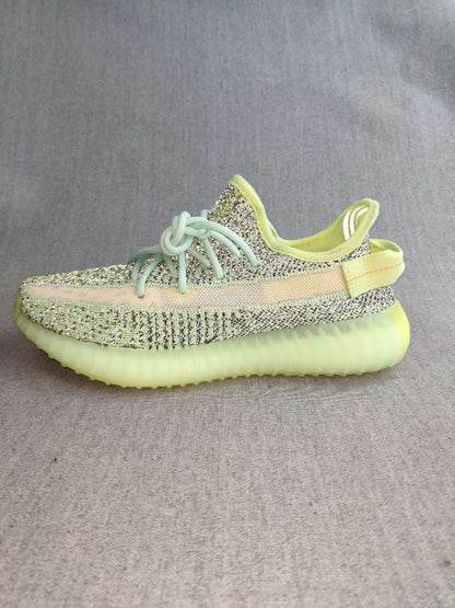 Profile view highlighting the side stripe, patterned upper, and ridged sole.