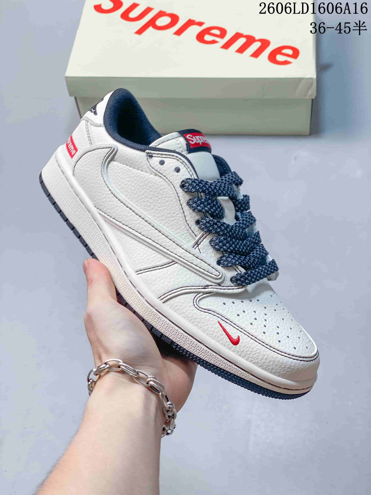 Jordan 1 Low Sneakers in White and Navy