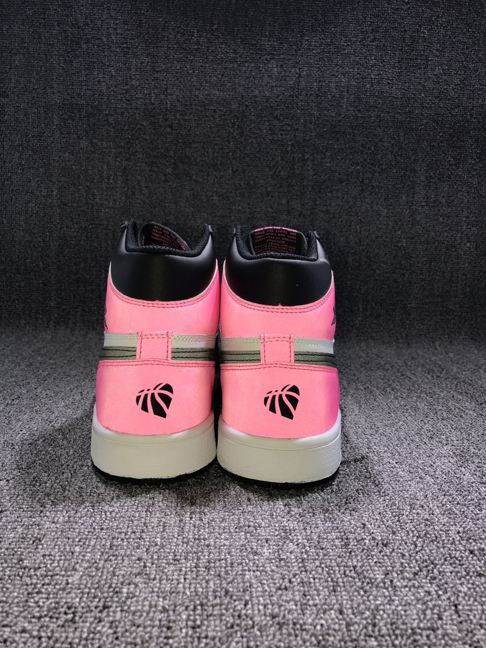 Back view of the pair showing matching pink heel panels, black collars, dark heel emblems, and white midsoles.