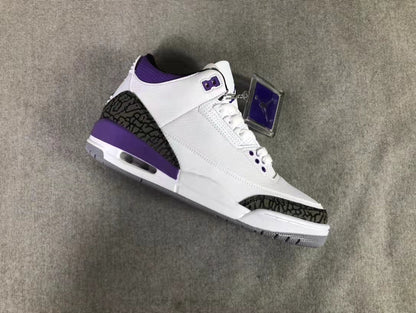Angled view highlighting the white upper, purple eyelet details, patterned overlays, and visible midsole window.