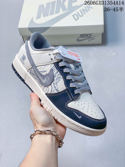 Nike Dunk Low x Undefeated Sneakers in White and Navy