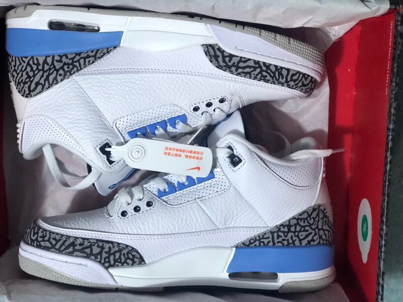 Pair of Jordan 3 Retro sneakers shown inside the box