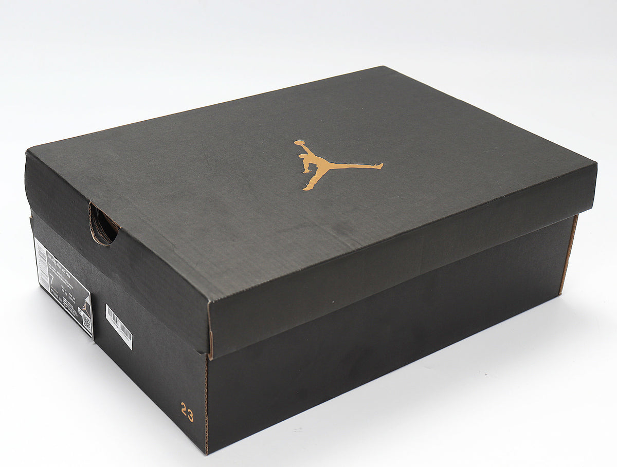 Black Jordan shoebox with a gold Jumpman logo and visible side labels.
