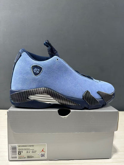 Close side view of the blue Jordan Air Jordan 14 sneaker and its box label showing EU 42, US 8.5, UK 7.5, and CM 26.5.