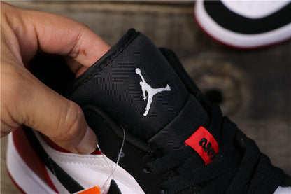 Close-up of the black tongue with white Jordan branding and a red tongue tag.