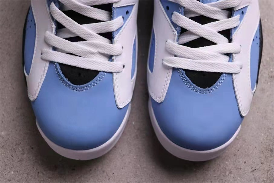 Close-up of the University Blue toe box, white lace panels, and white laces.