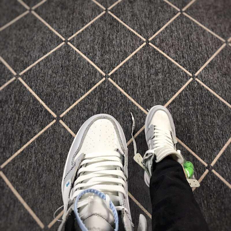 Top-down view of the perforated toe box, white laces and grey eyelet overlays.