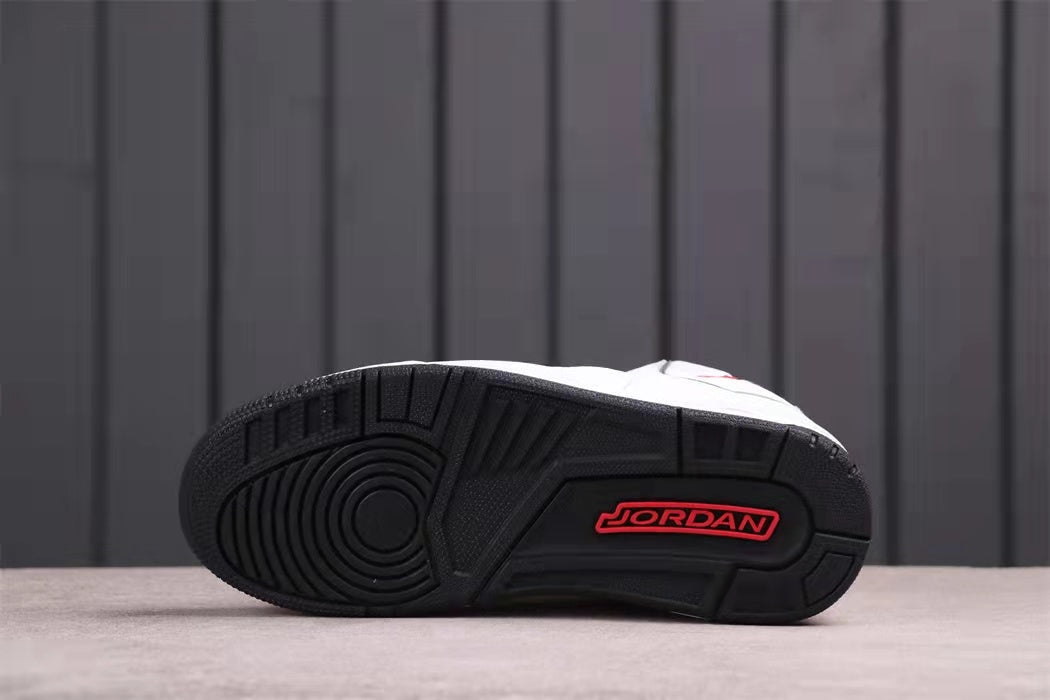 Bottom view showing the black patterned outsole with red Jordan branding