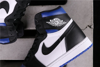 Angled close-up of a black, white and blue high-top sneaker with Jordan Wings branding.