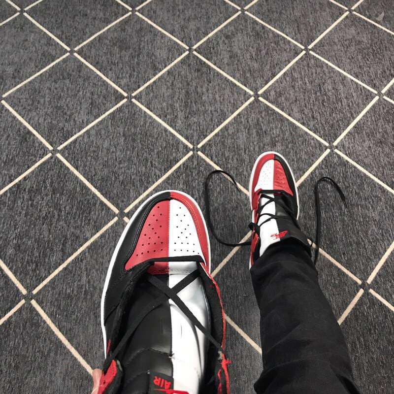 Top view of the black, red, and white color-blocked toe and tongue areas.