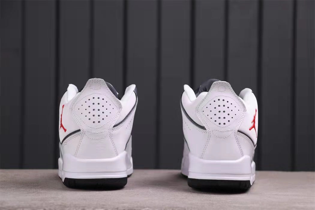 Rear view showing perforated heel panels, white midsoles, and black outsoles