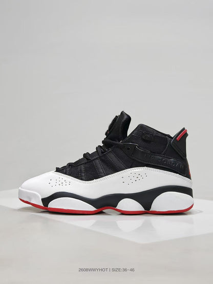 Side profile showing layered black upper panels, white side panels, and a red outsole edge.