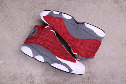 Pair of Air Jordan 13 sneakers arranged at an angle.