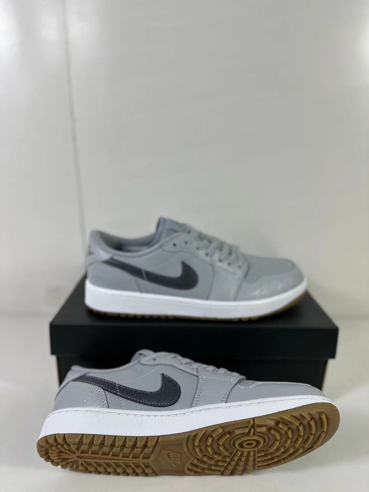 Side and outsole view showing the low-top profile, white midsole, and patterned gum traction sole.