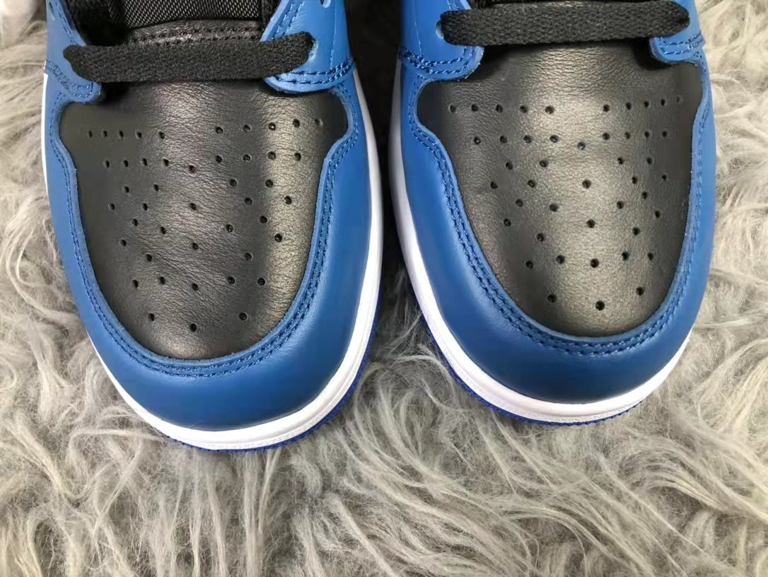 Close-up of the paired sneakers showing perforated black toe boxes, blue toe overlays, and black laces.