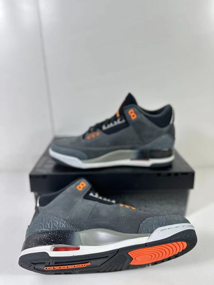 Angled underside view showing the black and orange rubber outsole pattern and the Jordan wordmark.