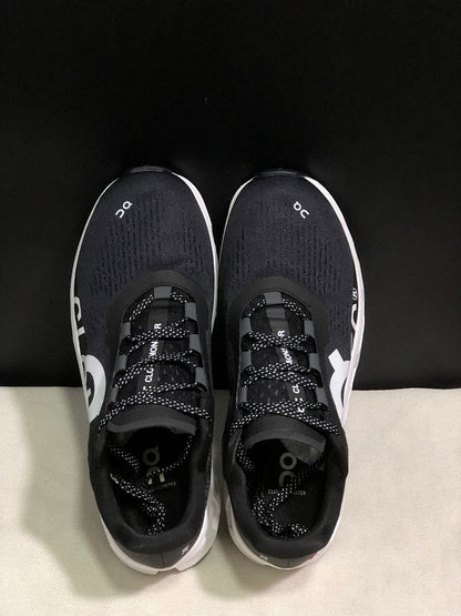On Cloudmonster Black and White Running Sneakers