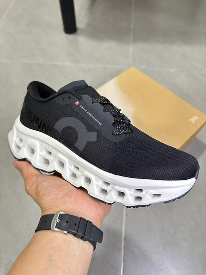 On Running Black and White Road Running Sneakers