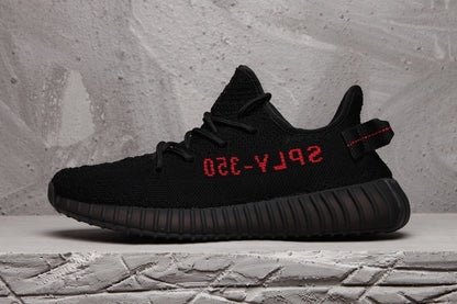 Yeezy Boost 350 V2 Black Knit Sneakers with Red Accents