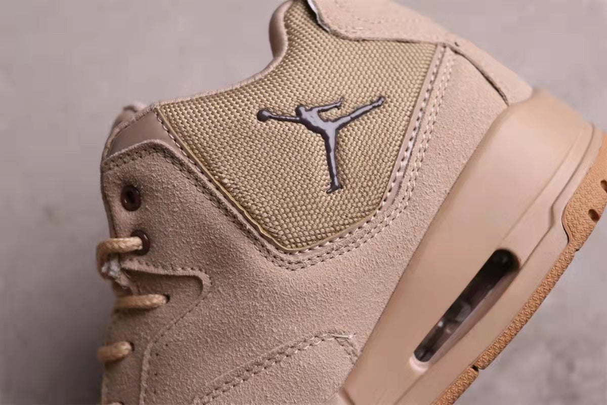 Close-up of the textured side panel, Jordan logo, stitching, and visible sole window.