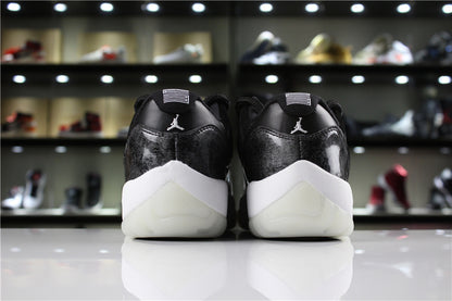 Straight rear view showing the heel logos, black upper panels, white midsoles, and translucent heel outsoles.