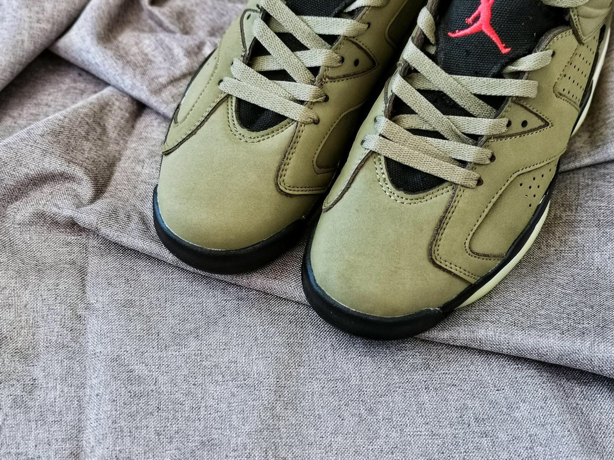 Top-down close-up showing the olive toe boxes, laces, perforated panels, and black tongues.